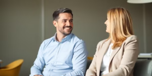 Man and woman talking in a modern office.